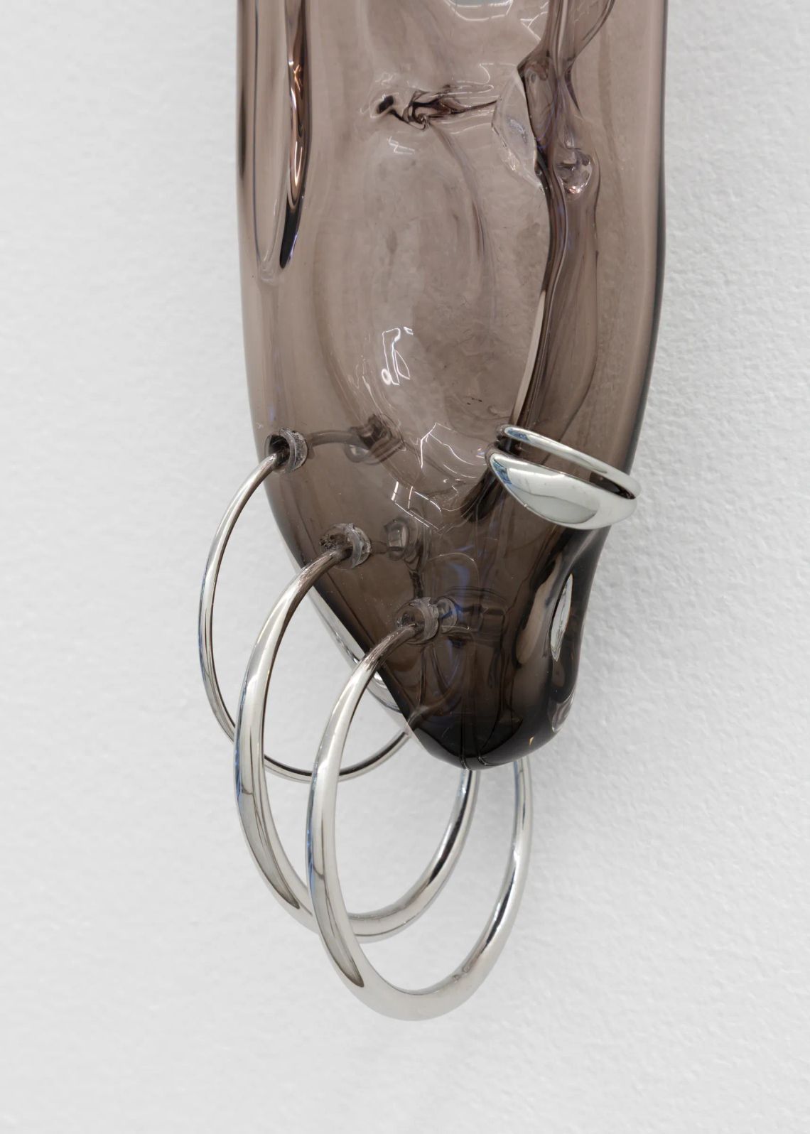 Glass ear sculpture in smoked glass and stainless steel mounted on wall, Floryan Varennes Spike series at Xxijra Hii London