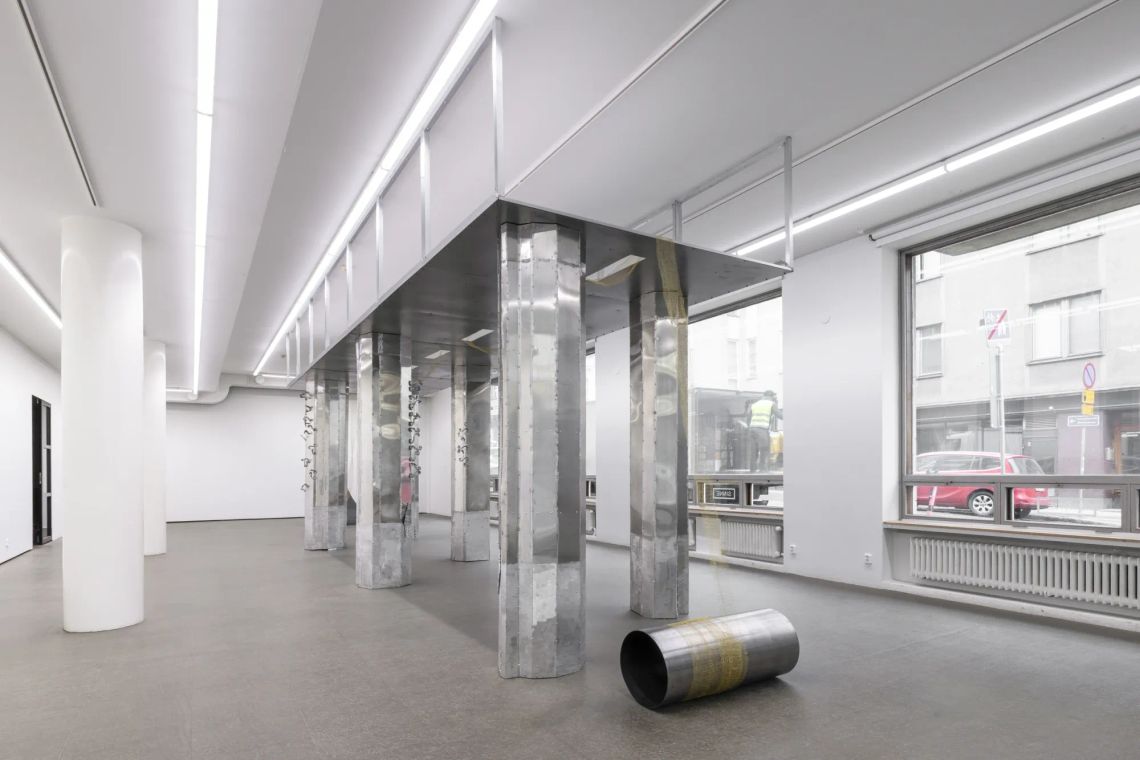 Maija Fox Hard Shoulders installation view showing bridge-like metal structure with vertical columns inside gallery space at Sinne Helsinki
