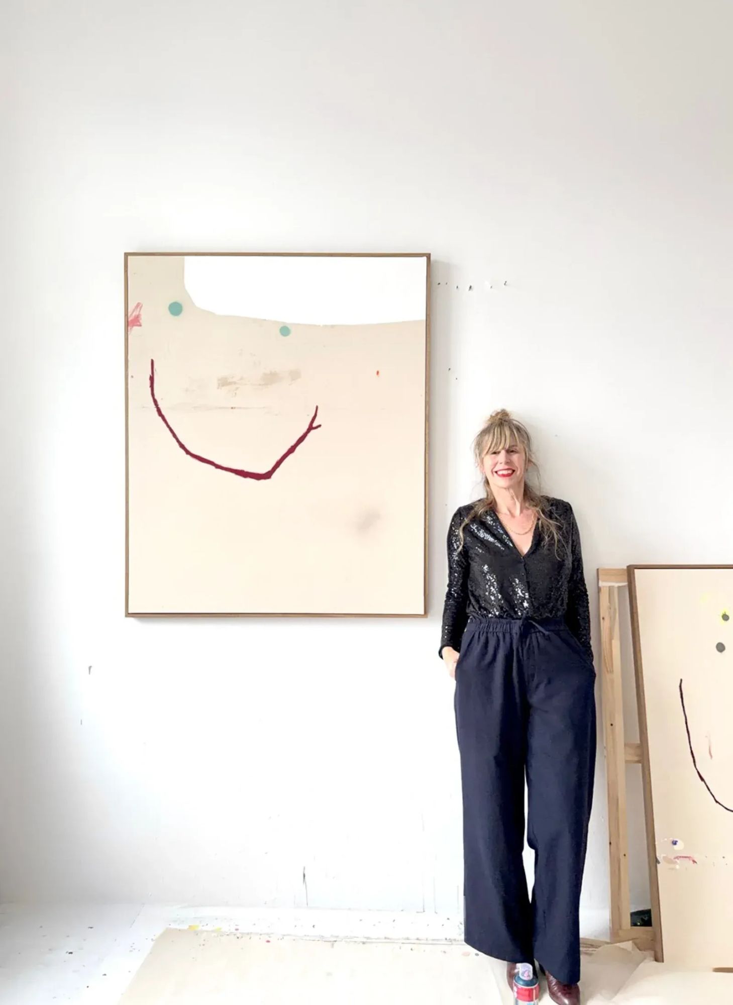 Christina gschwantner with painting as a moment of relief in artist in focus catapult munchies art club artist in her studio