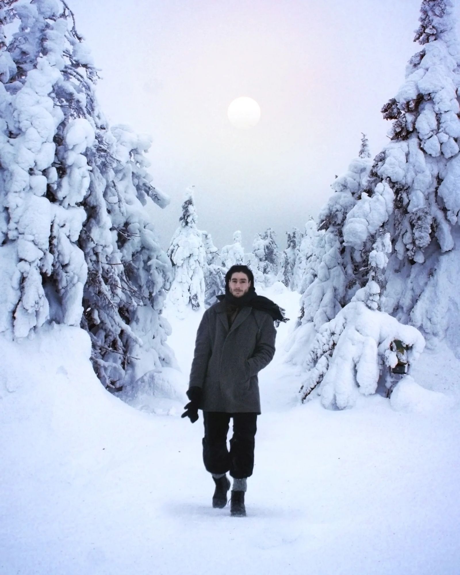Andreas R Andersson walking through snow covered forest, Arvidsjaur 2023, portrait, winter landscape, Photo by Mikael Andersson