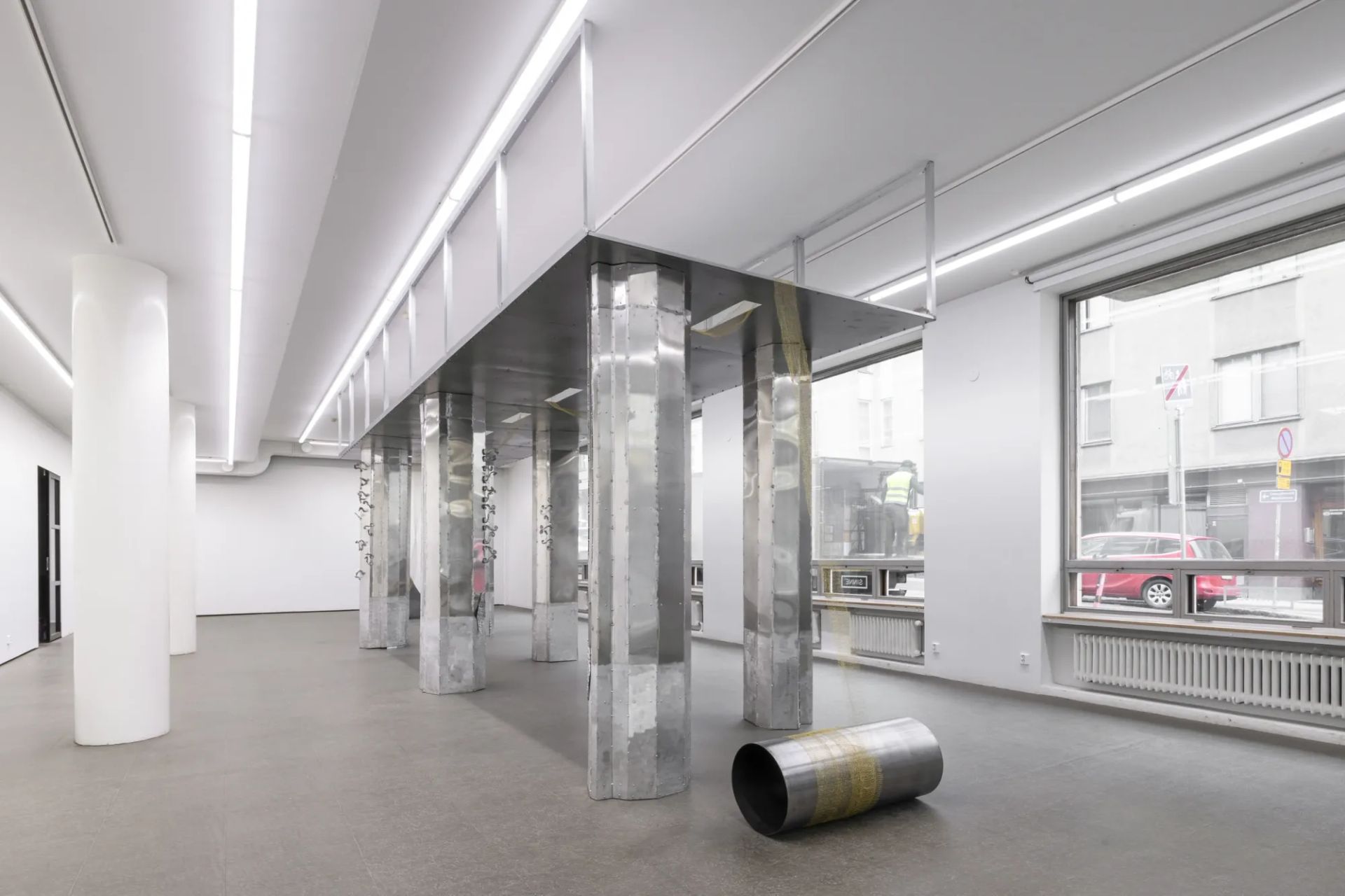 Maija Fox Hard Shoulders installation view showing bridge-like metal structure with vertical columns inside gallery space at Sinne Helsinki