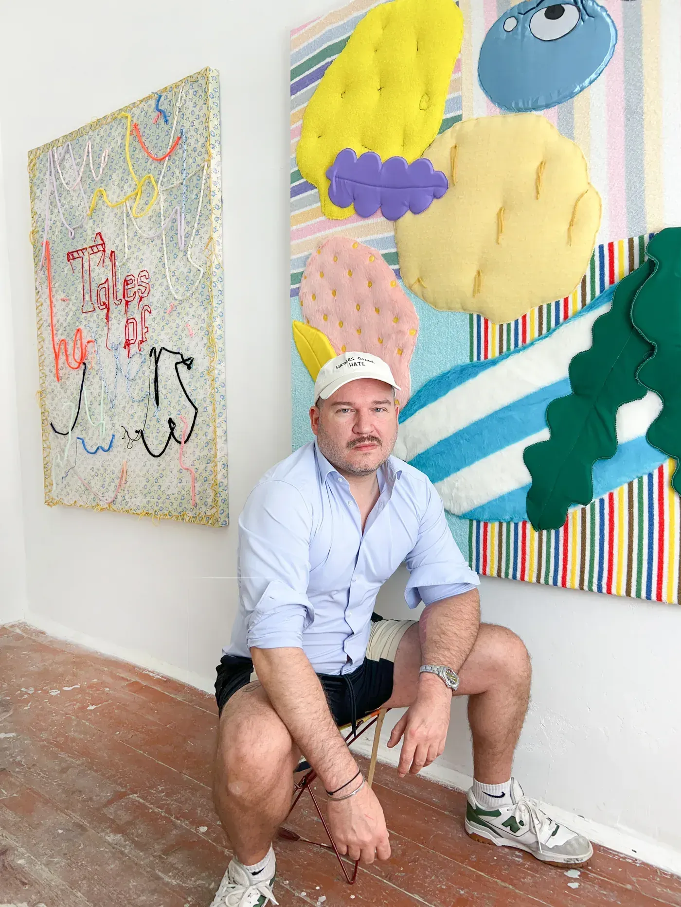 Daniel Ferstl, artist in focus on Catapult Contemporary , Vienna emerging artist spotlight in his studio with textile works on the walls , artist portrait