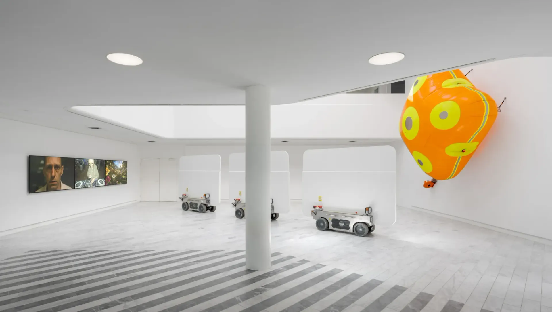 Louis Morlæ, Walls at the World's End, Tranen, Hellerup, 2026, installation view with robotic walls, AI films, and orange airbag - Catapult exhibition review