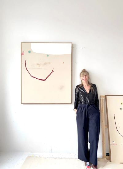 Christina gschwantner with painting as a moment of relief in artist in focus catapult munchies art club artist in her studio