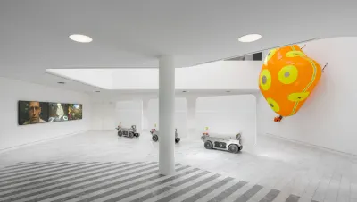 Louis Morlæ, Walls at the World's End, Tranen, Hellerup, 2026, installation view with robotic walls, AI films, and orange airbag - Catapult exhibition review
