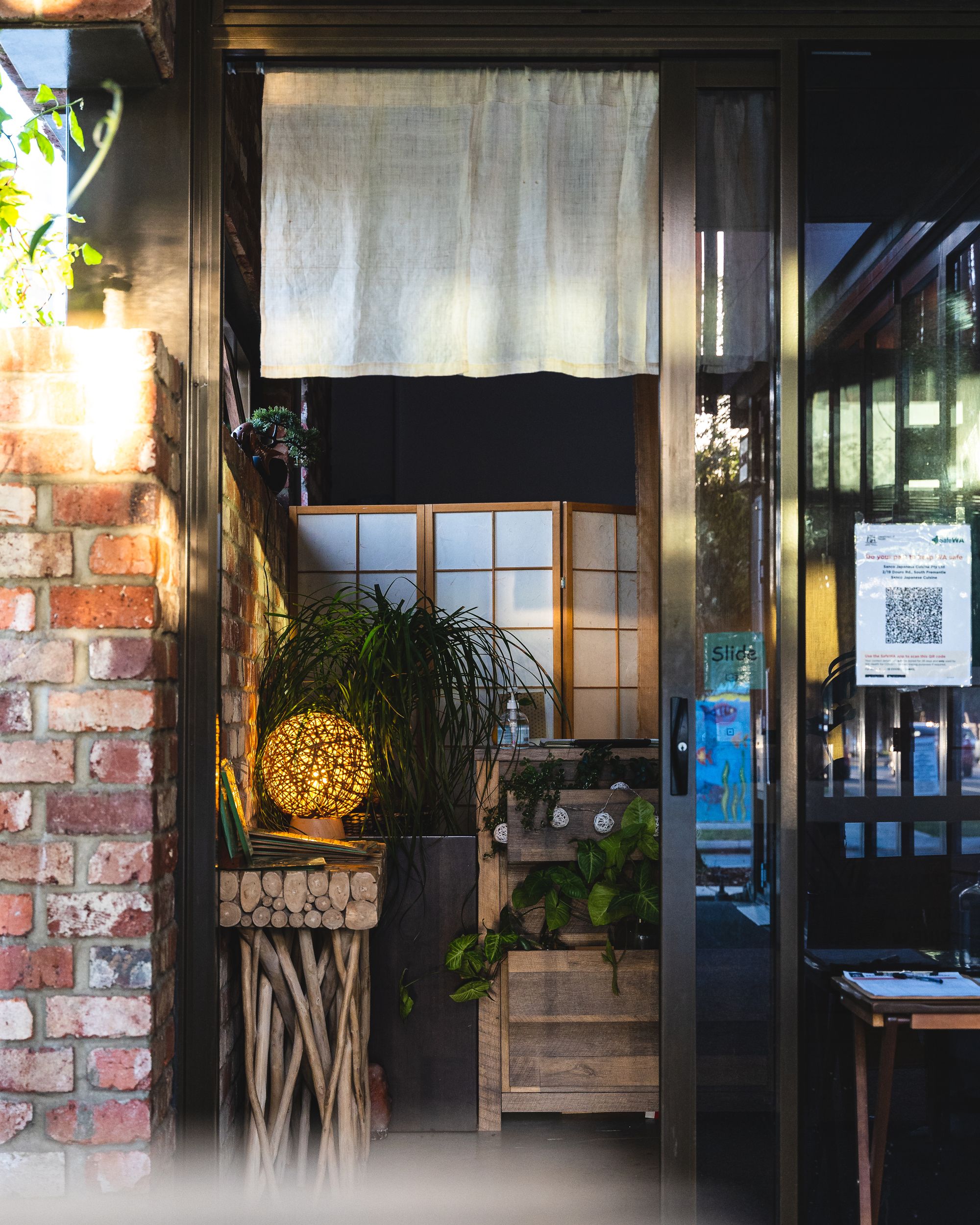 SLiding door showing the entrance to Sanco