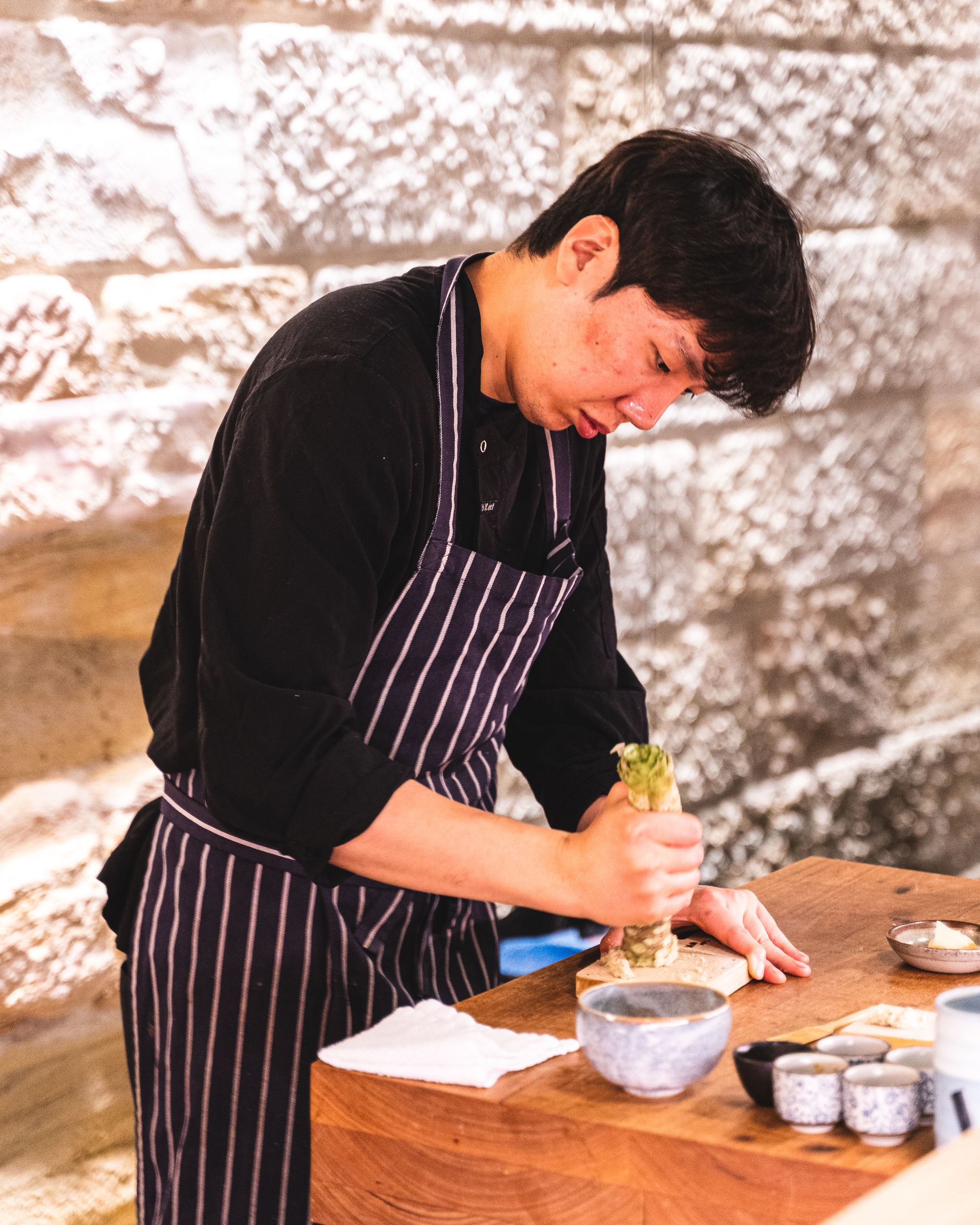 Chef grating a wasabi root