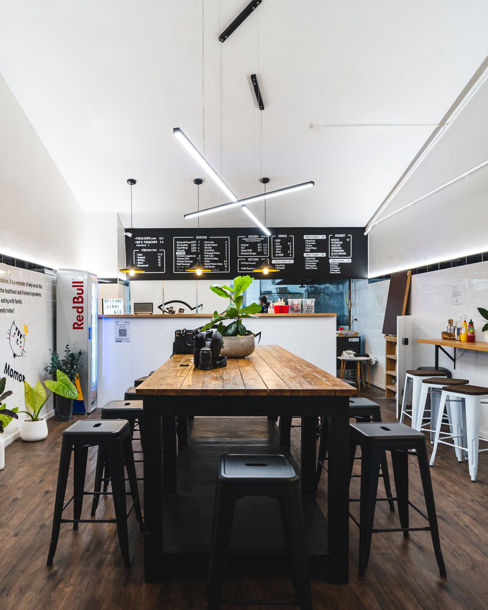 Jinny&Co interior showing a large communal dining table