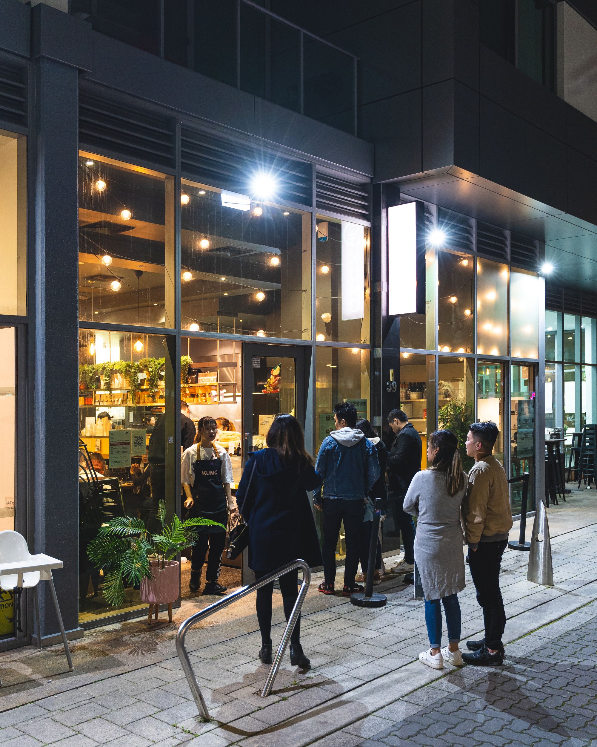 People lining up to go into Kumo