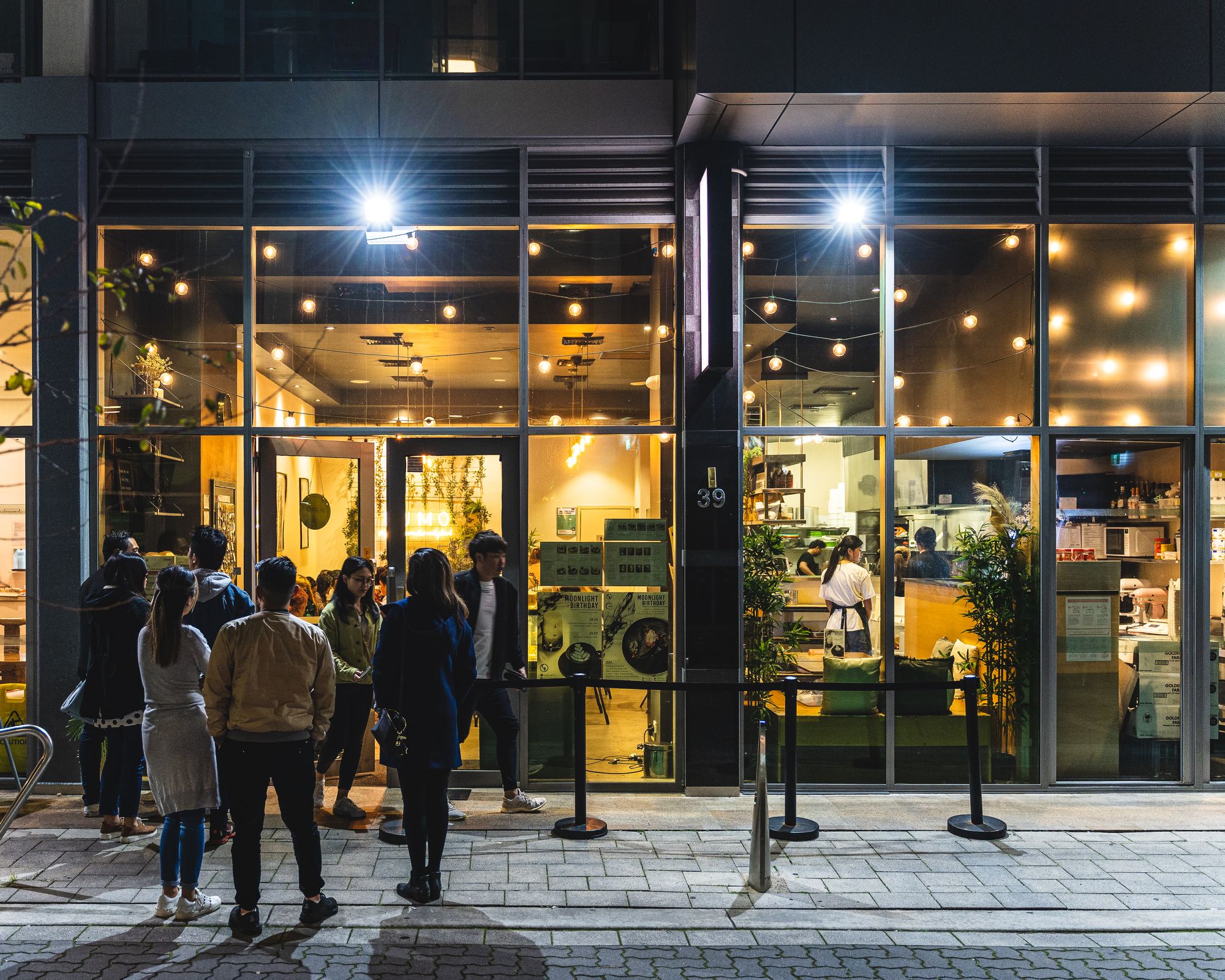 People lining up to go into Kumo