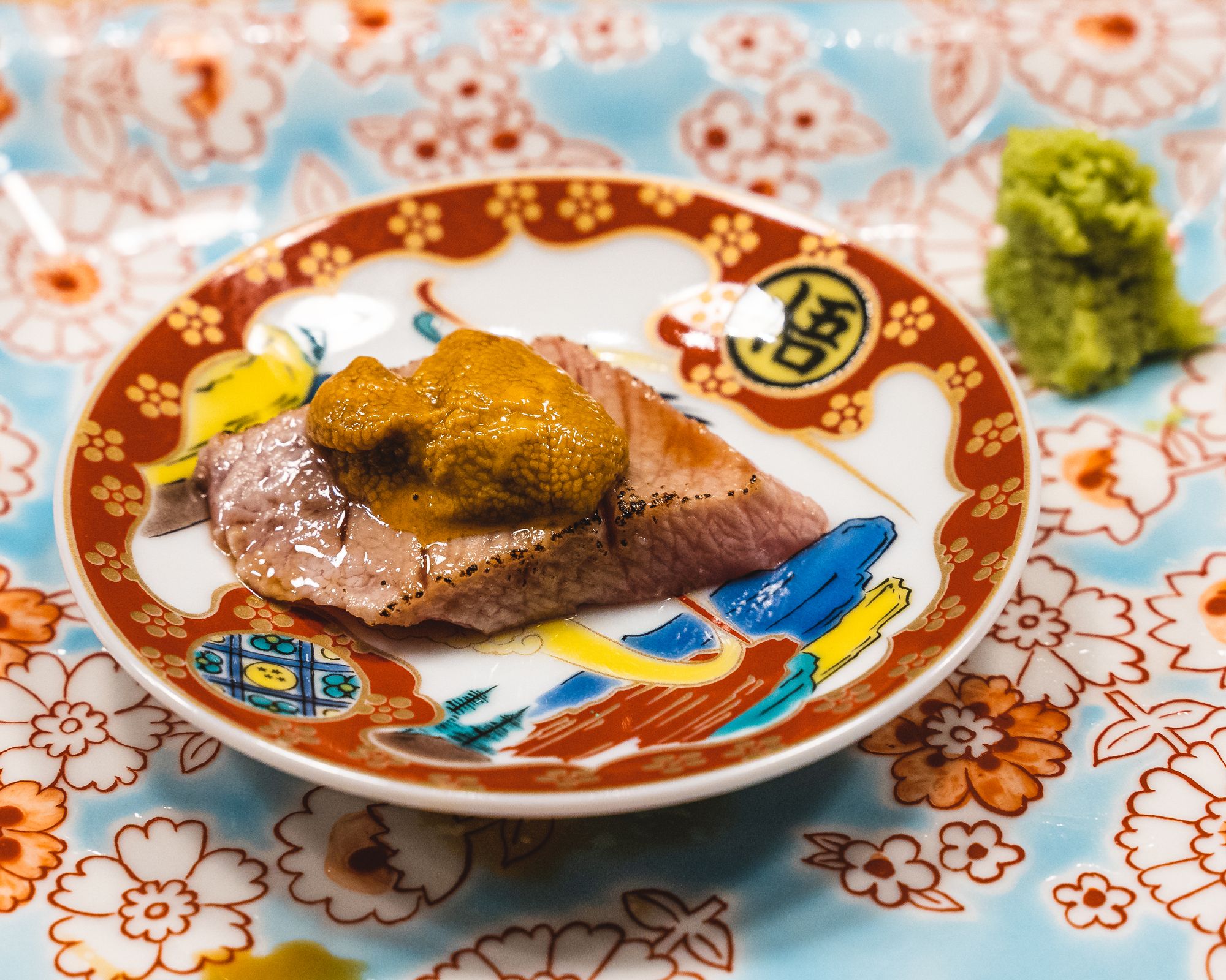 Close up of Australian wagyu served with uni on top