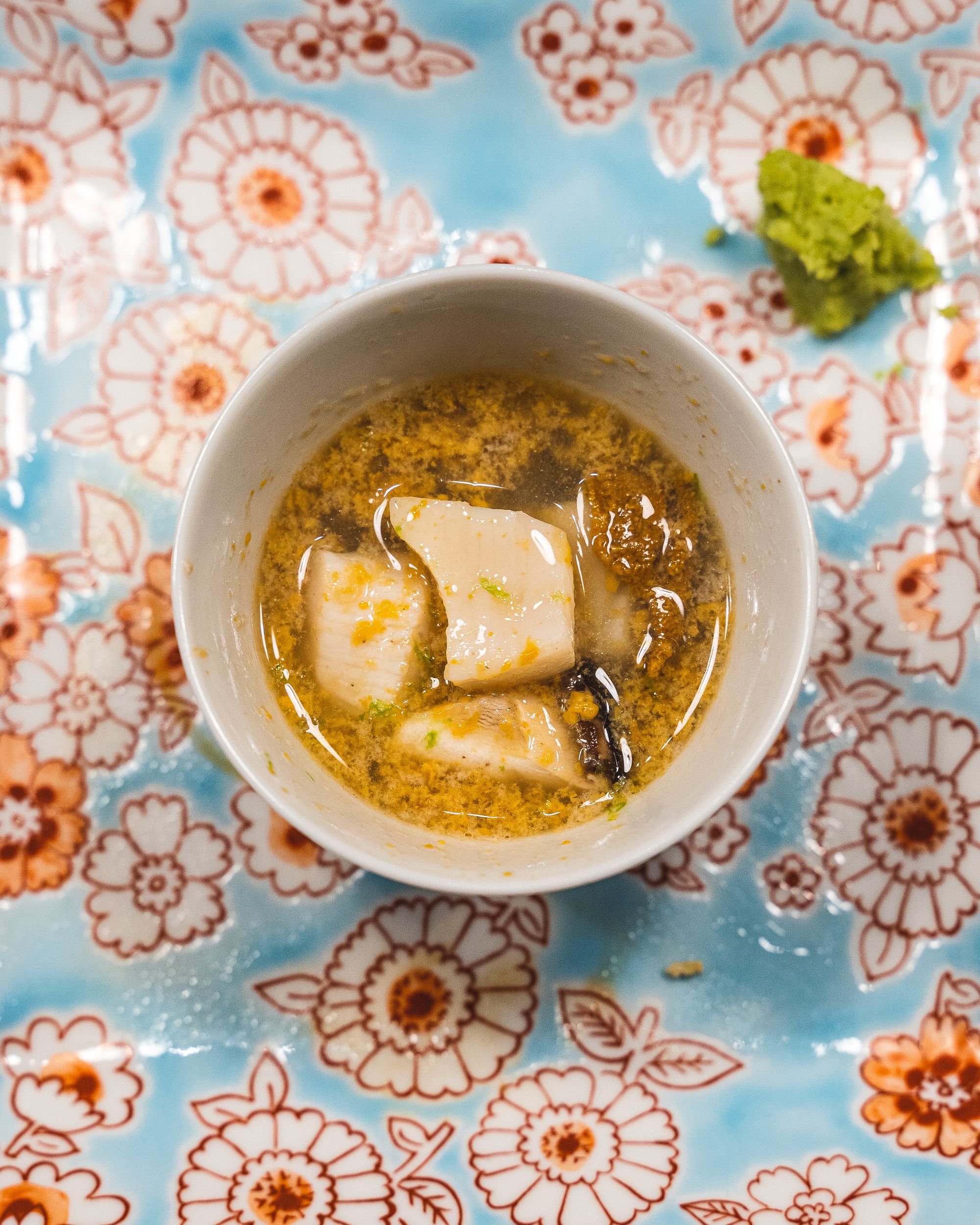 Close up of uni, hotate and mushroom soup