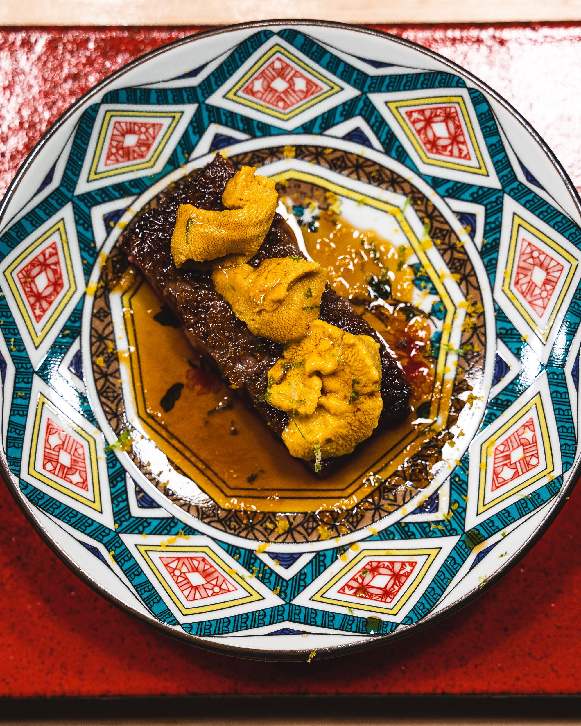 Close up of Australian wagyu served with uni on top