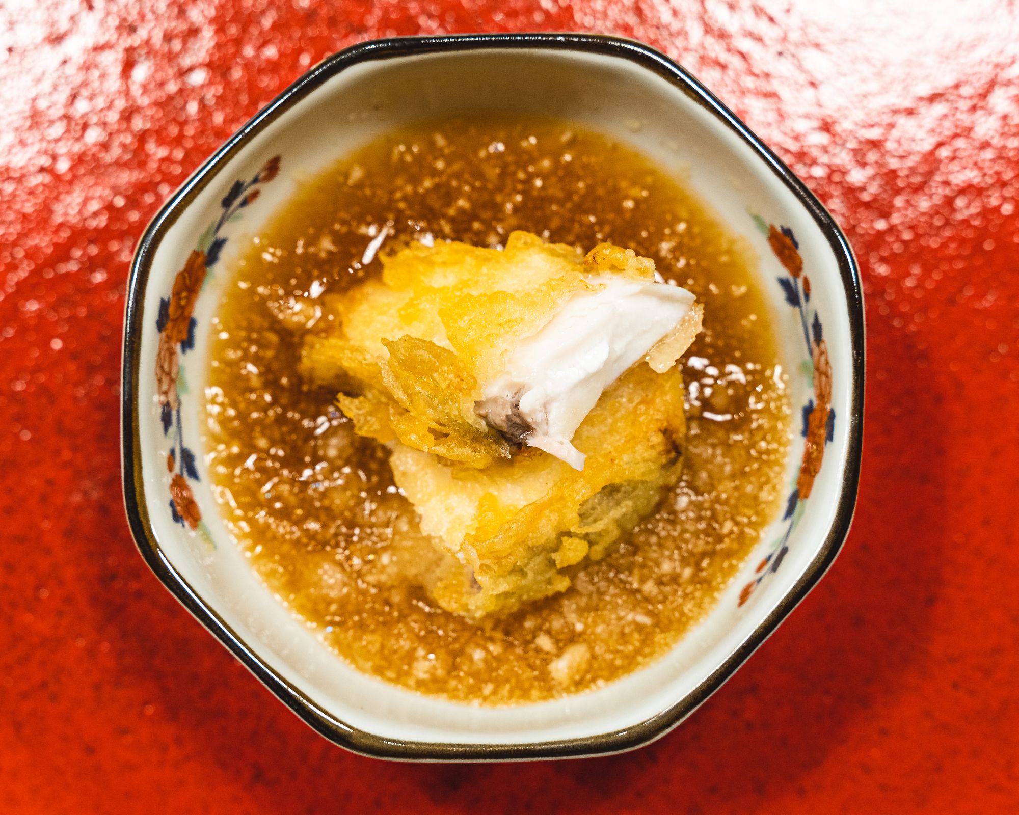 Fried fish in a broth