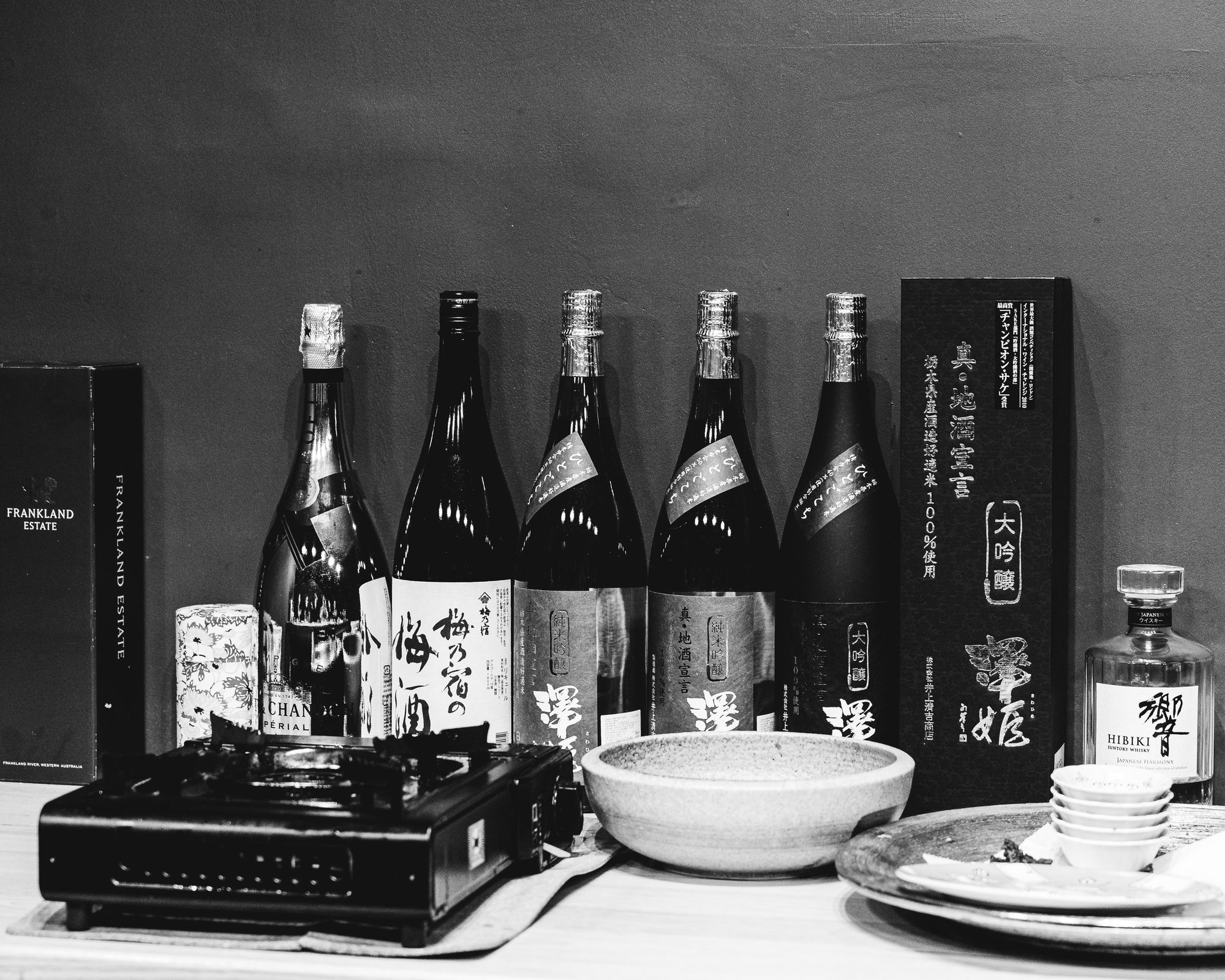 A range of alcohol against a wall