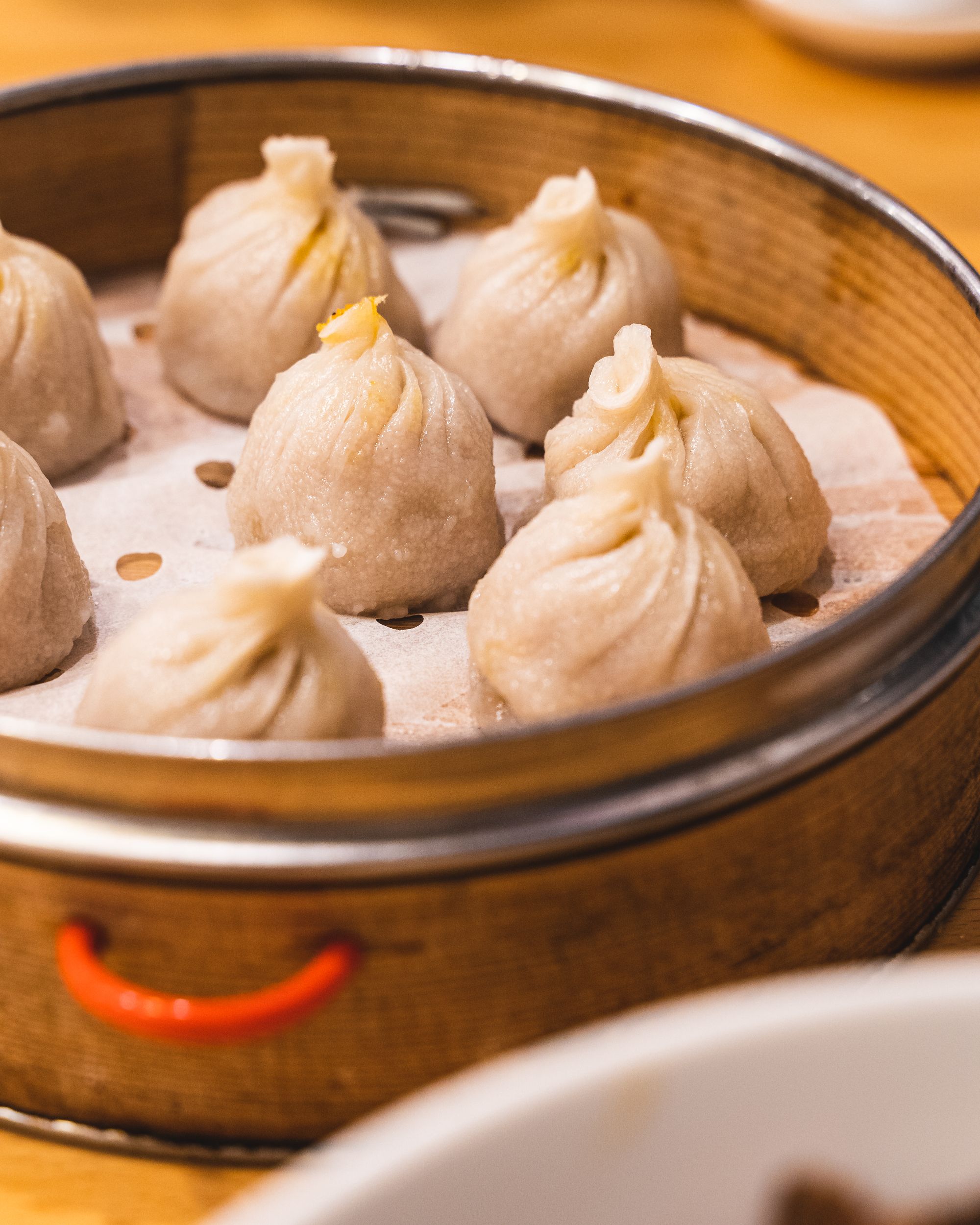 Close up of xiao long bao in steamer