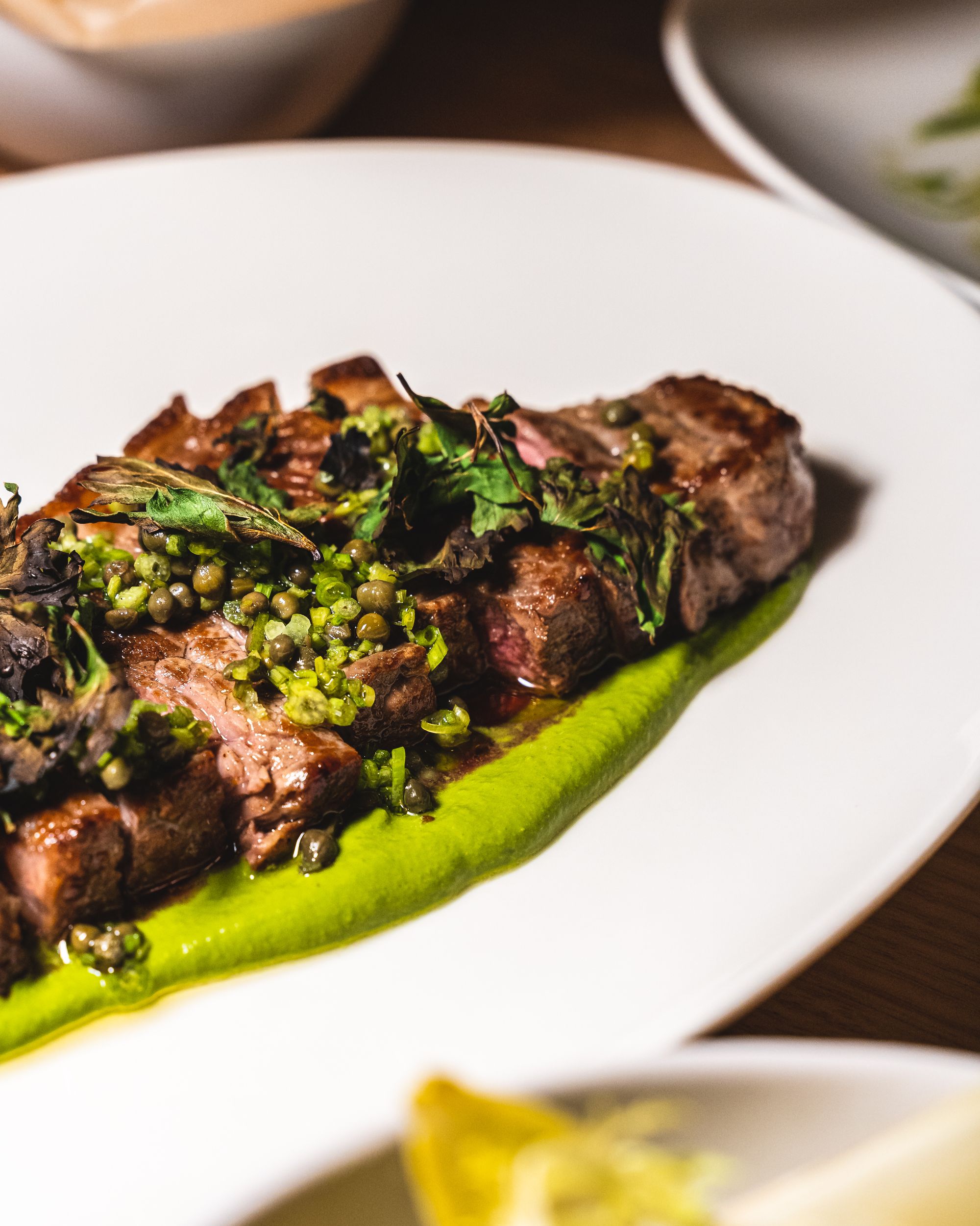 Close up of steak with salsa verde sauce