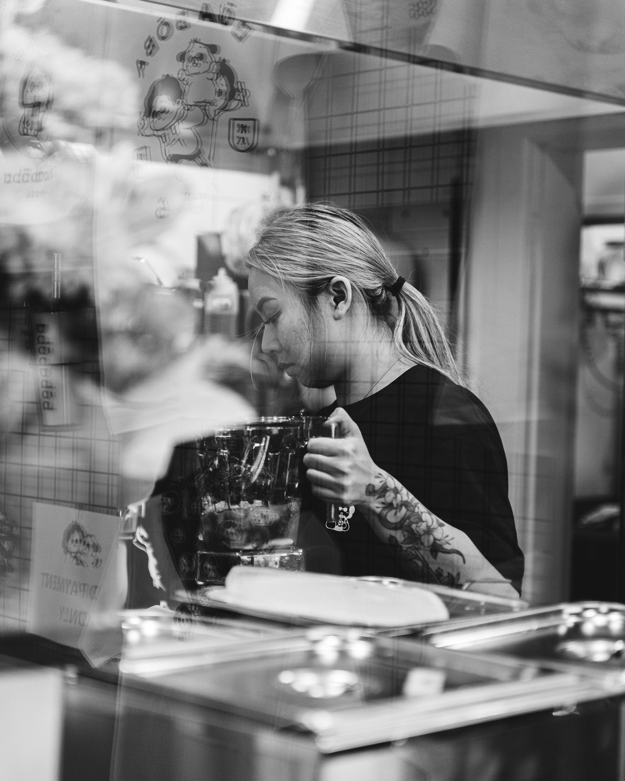 Staff member making boba