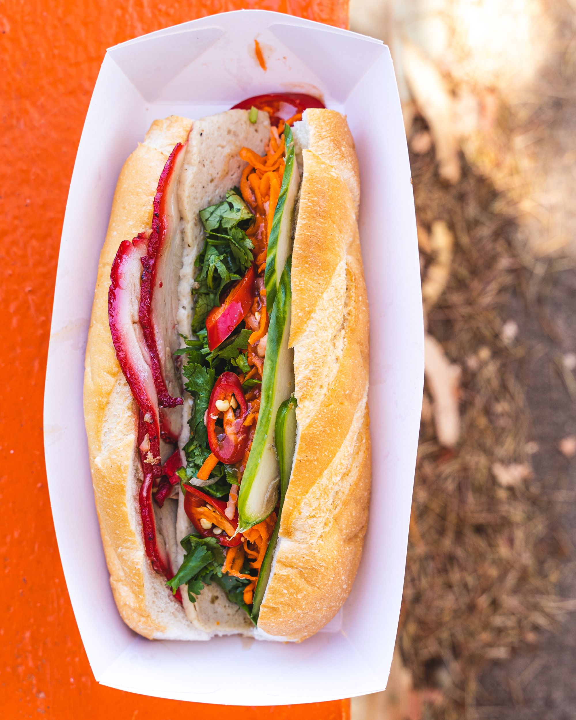 Top down shot of traditional banh mi with chilli