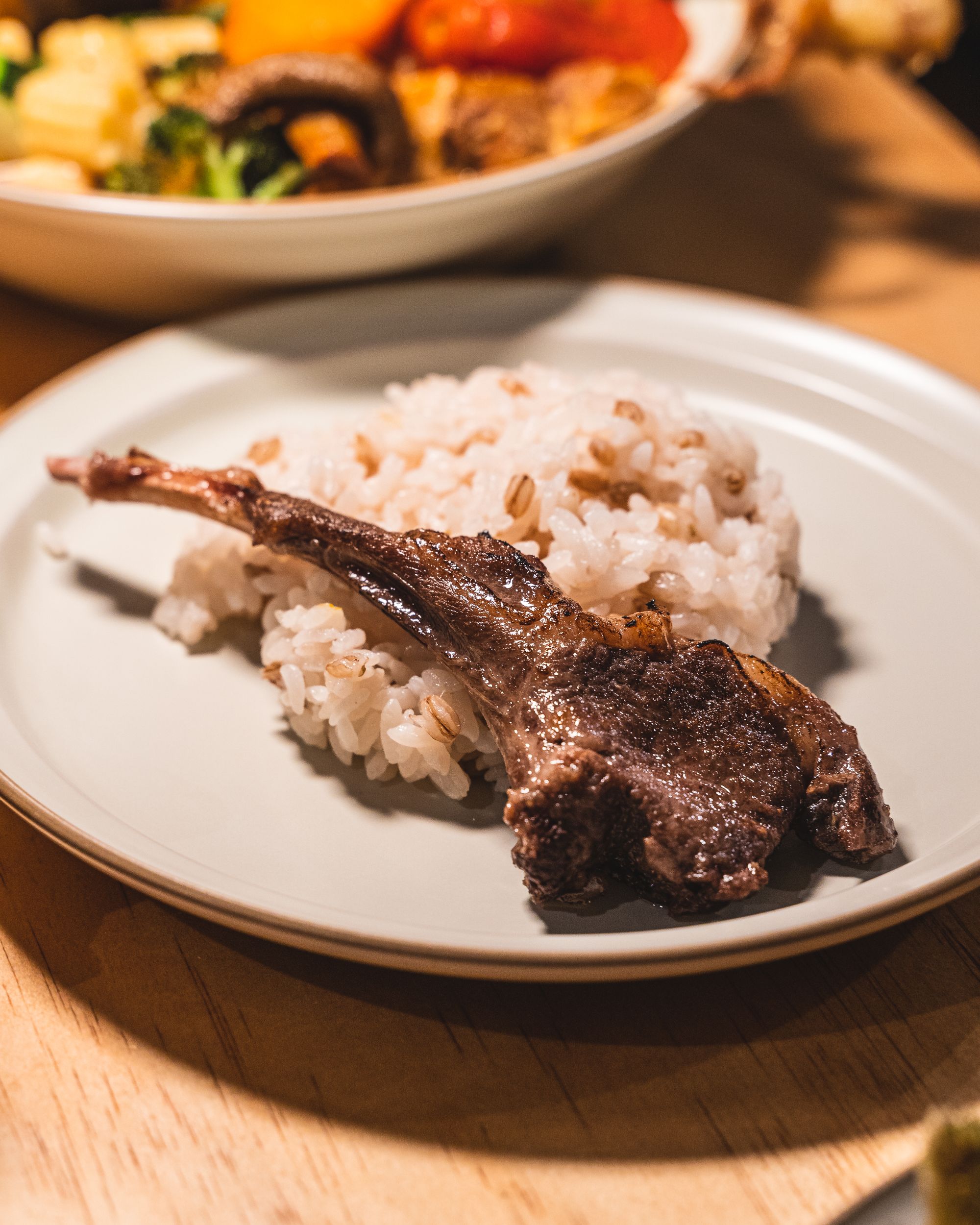Lamb cutlet served on-top of rice
