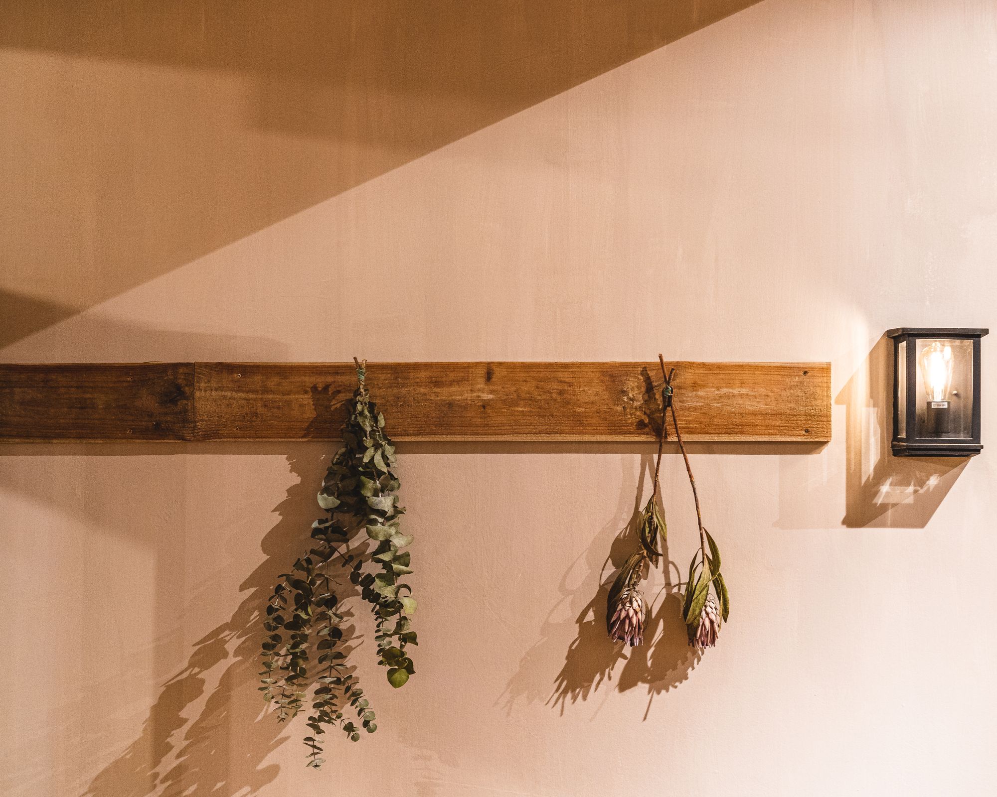Leaves with branches hung upside down for wall decoration
