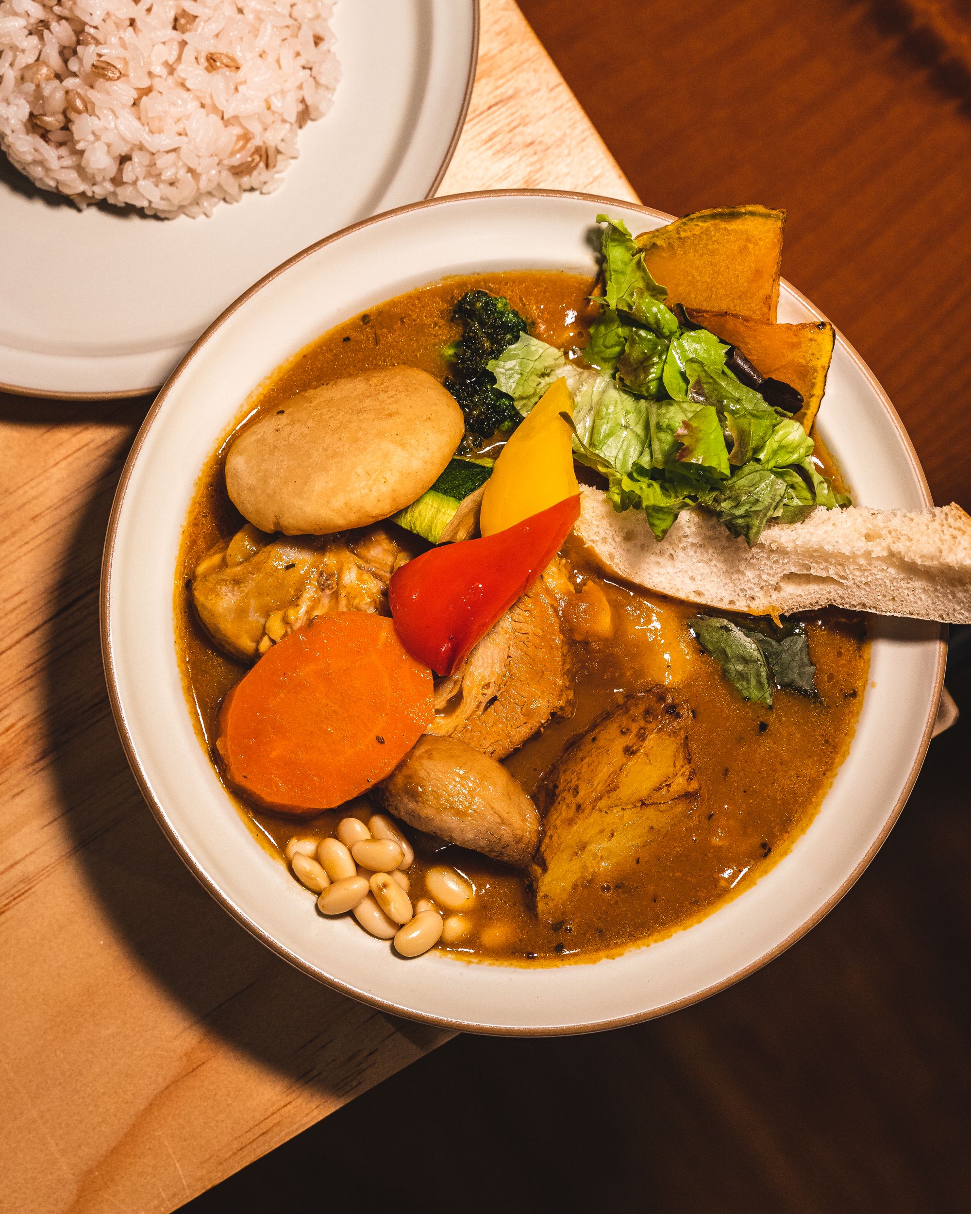 Top down shot of soup curry with different vegetables