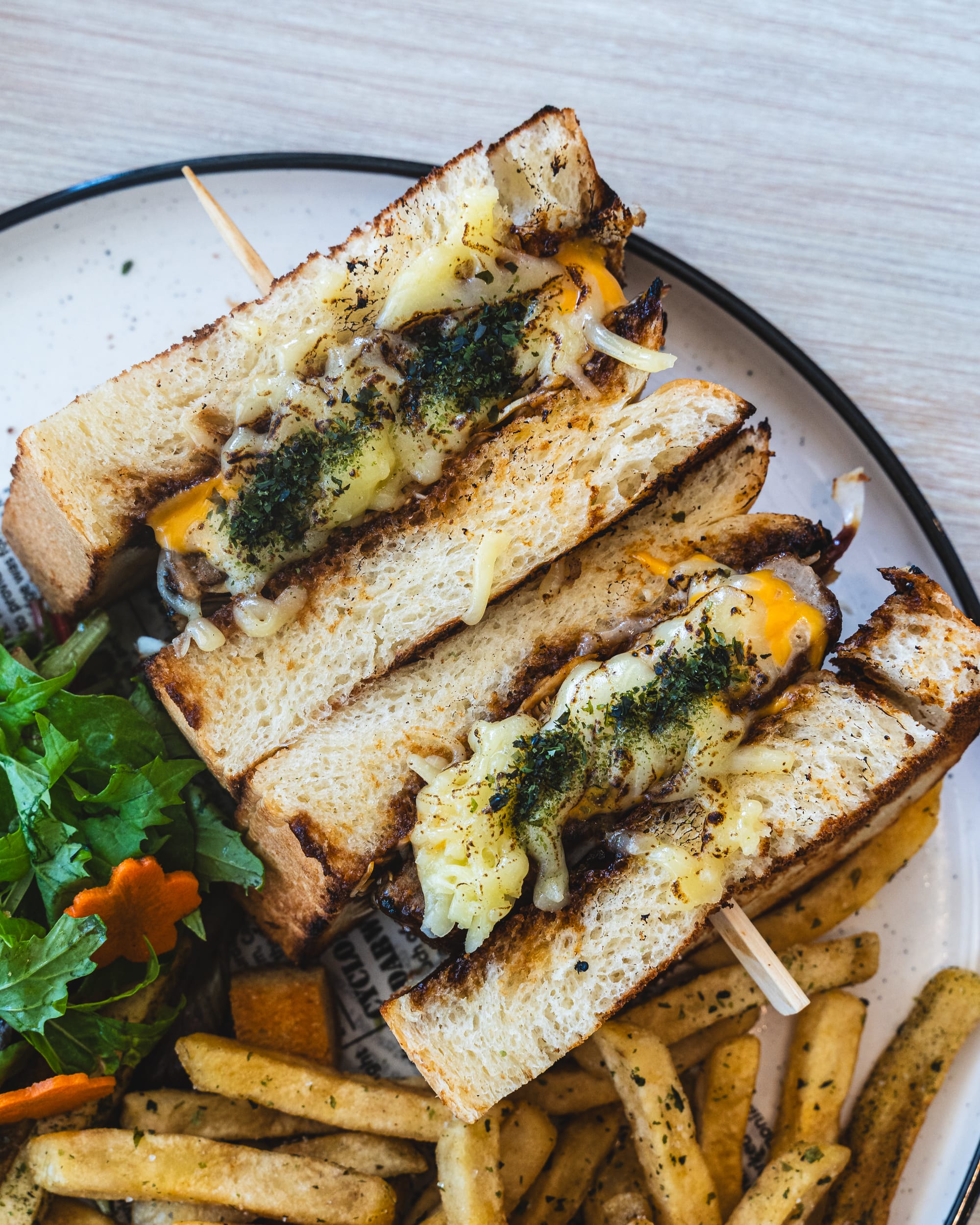 Close up of hamburg sandwich with fries vegetables