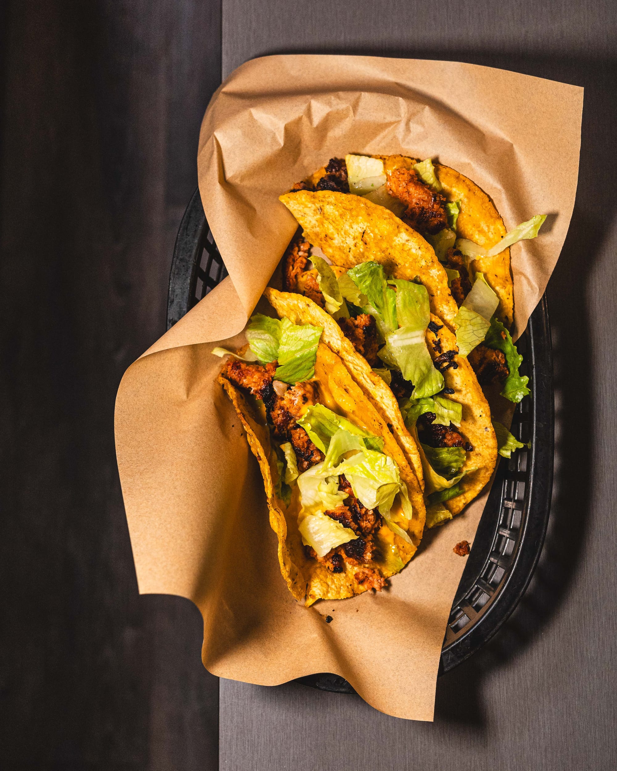 Top down shot of tacos with lettuce and chorizo