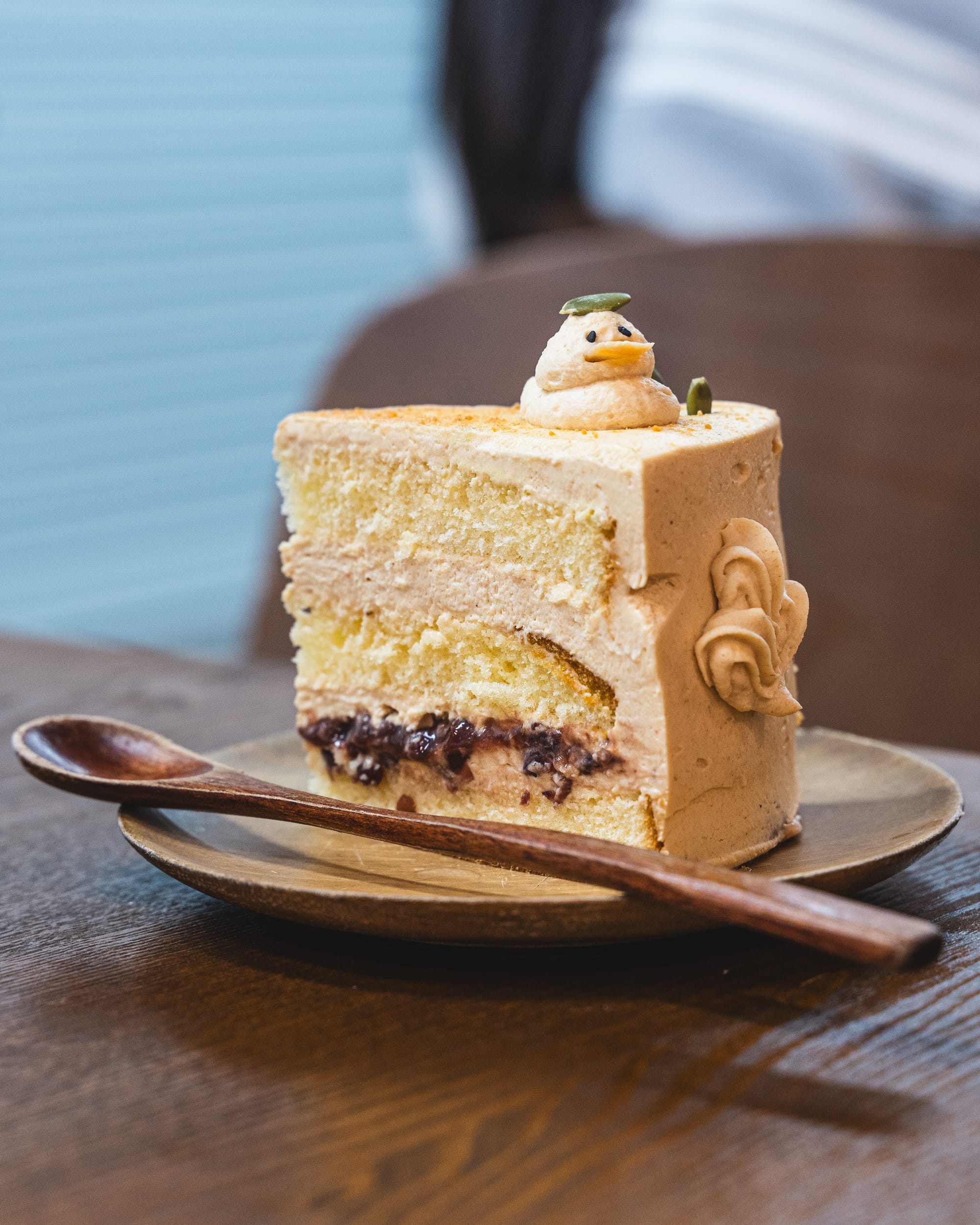 Close up of cake with a duck made from cream on top