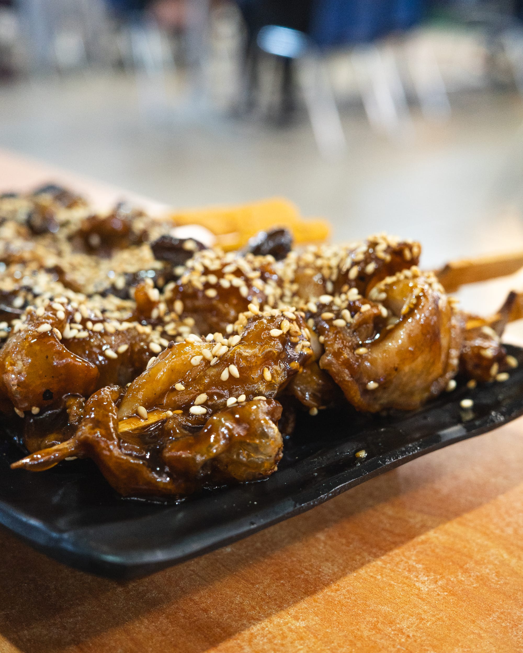Close up of grilled chicken skin skewers