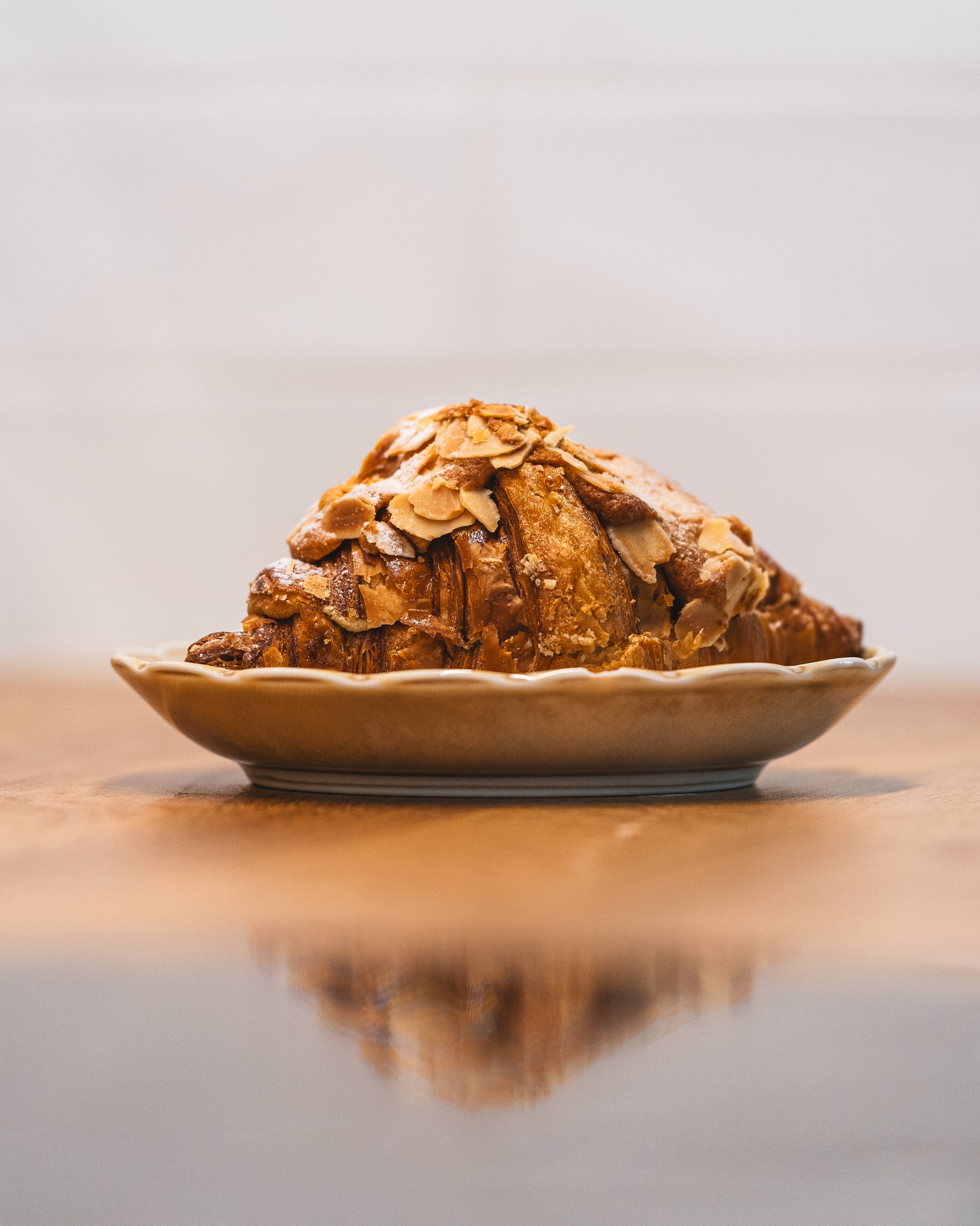 Close up of almond croissant on a plate