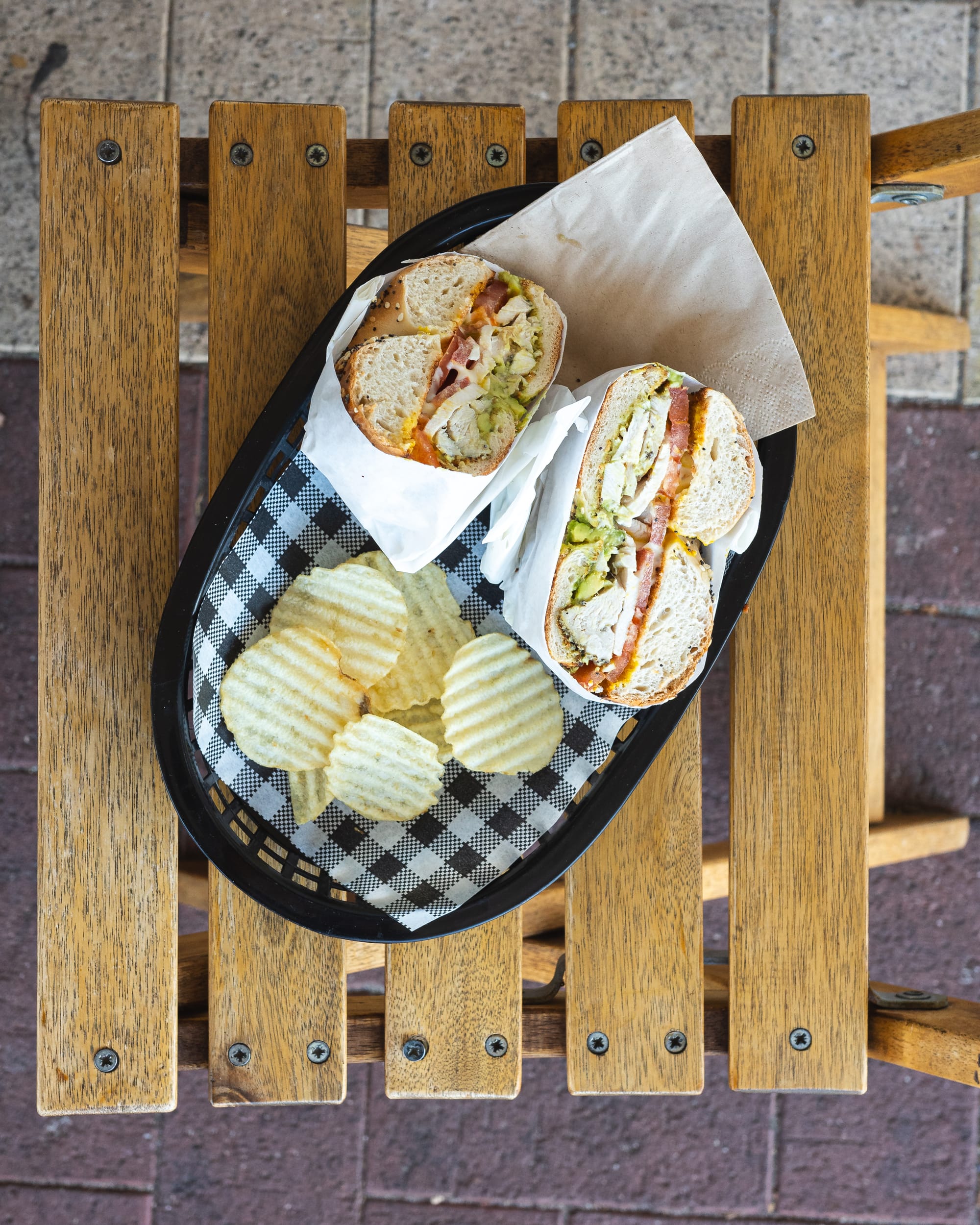 Top down shot of bagel with crisps