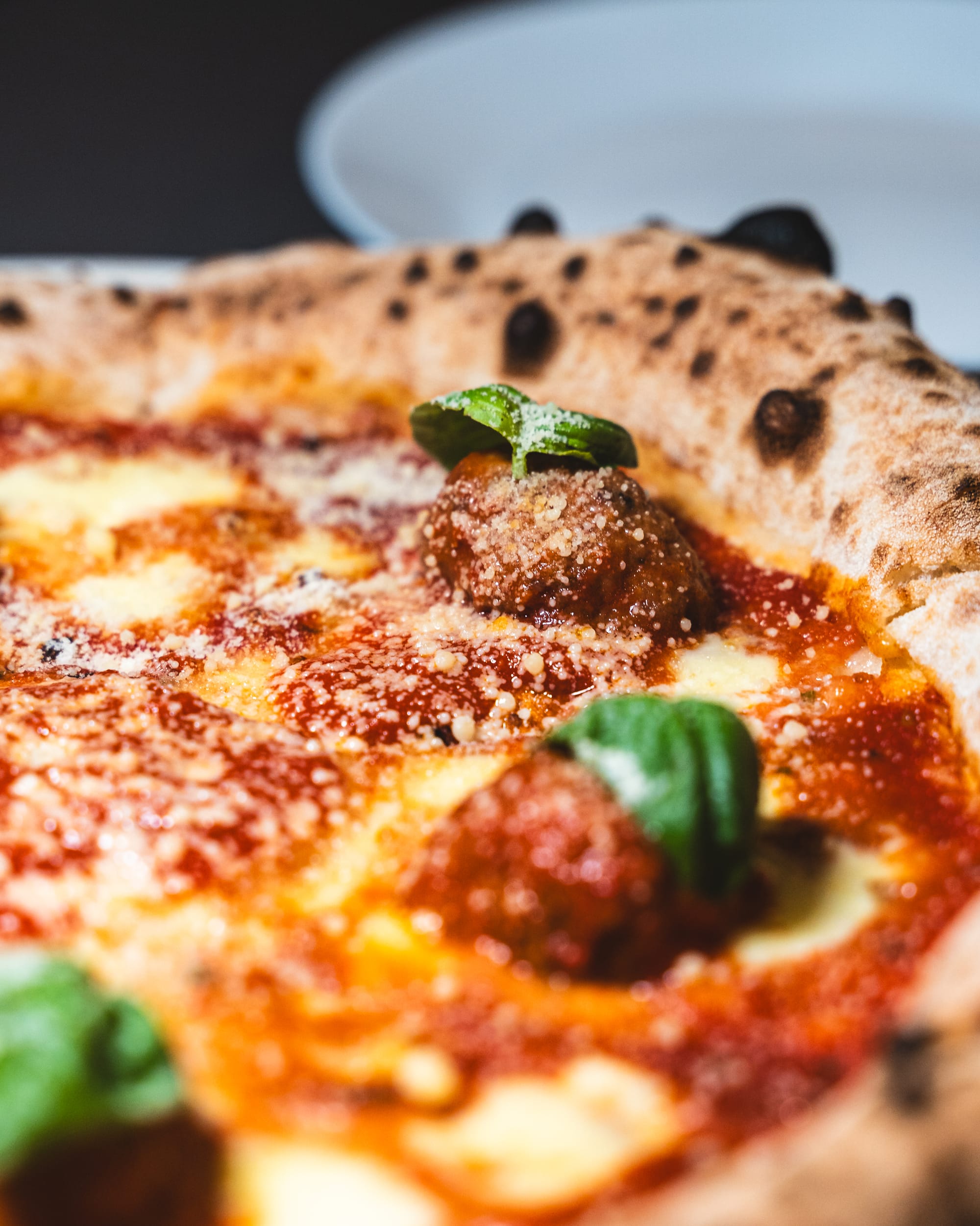 Close up of meatball on pizza