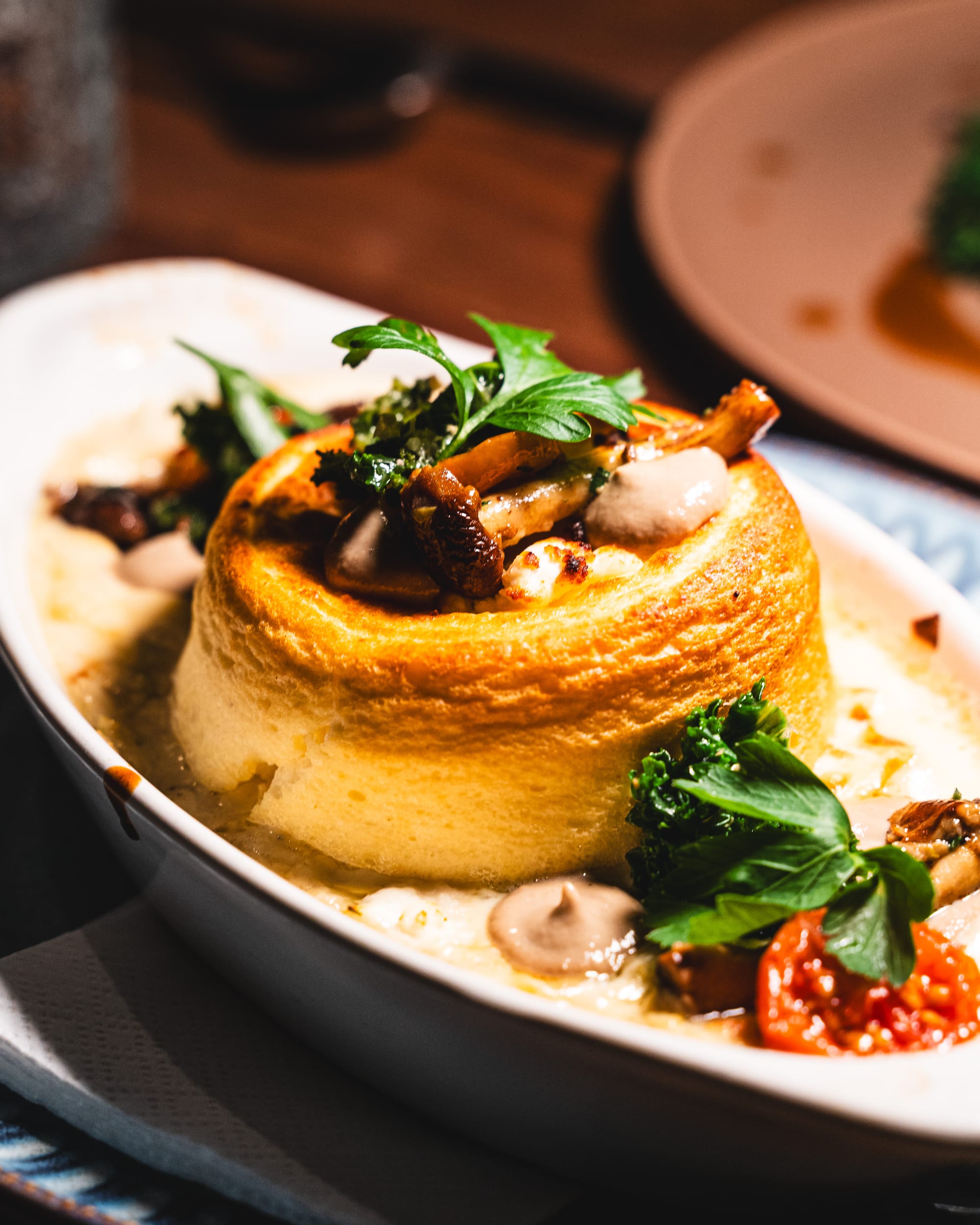Souffle with leek fondue and vegetables on the side