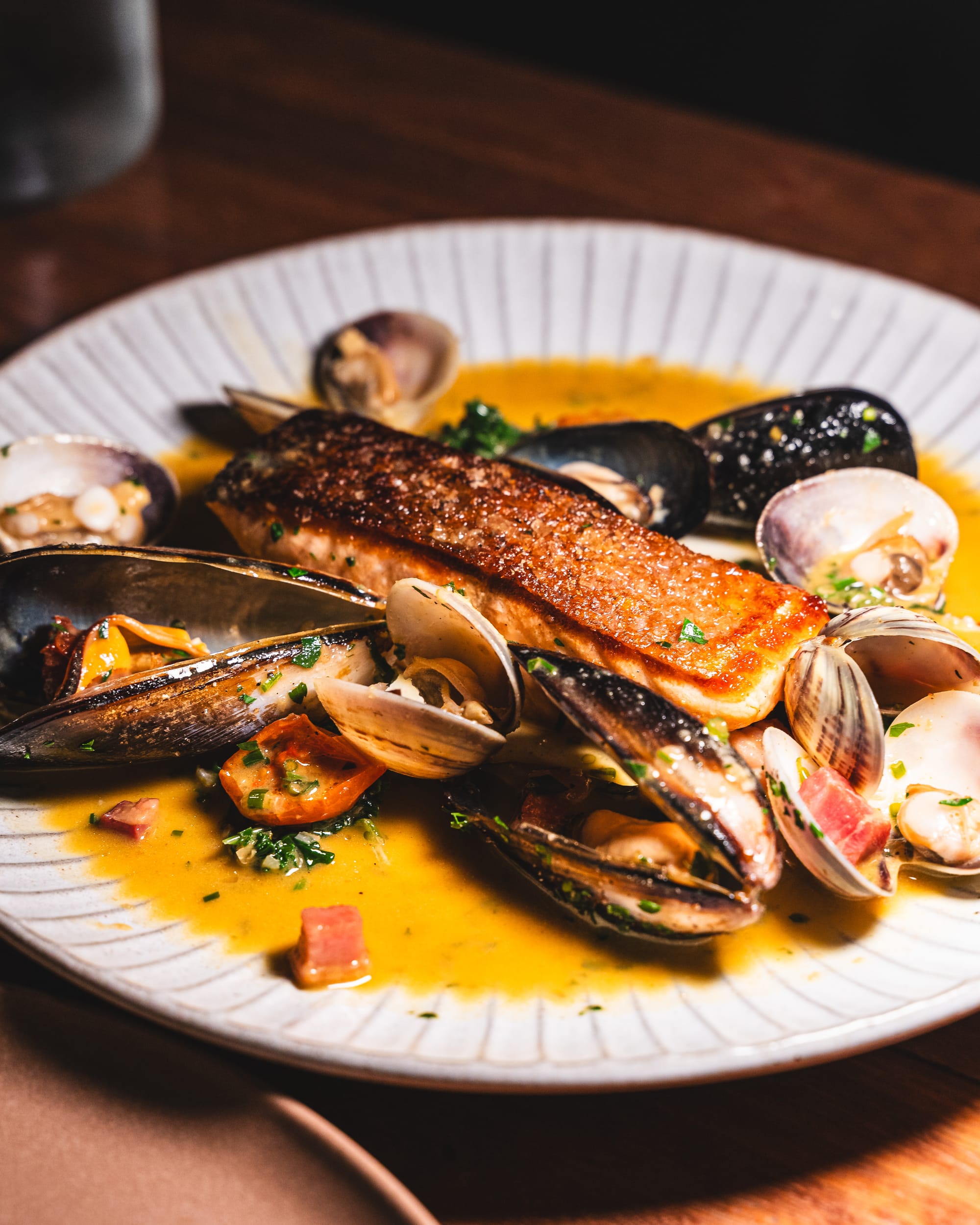 Salmon with butter sauce and clams