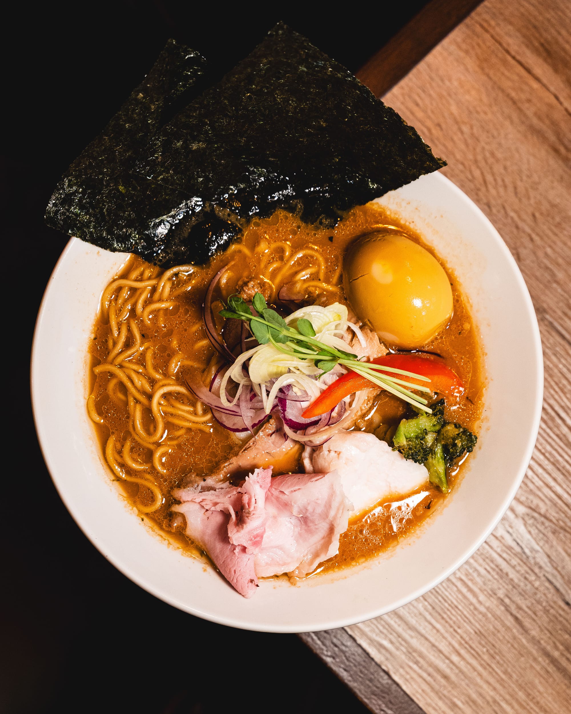 Bowl of tonkotsu ramen with chashu, egg, and nori.