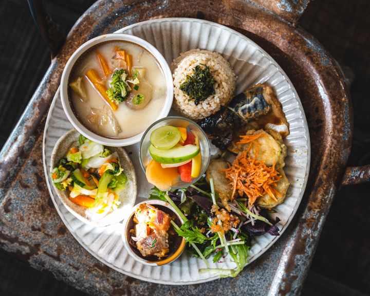 Overhead shot of a plate with many different smaller dishes in smaller bowls