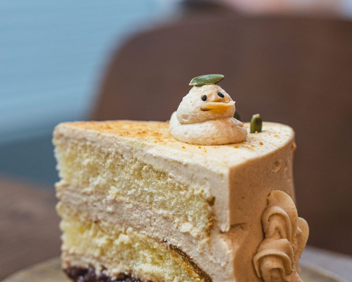 Close up of cake with a duck made of of buttercream on-top