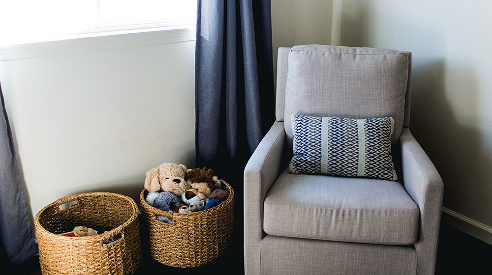 comfy glider rocking chair in a nursery room