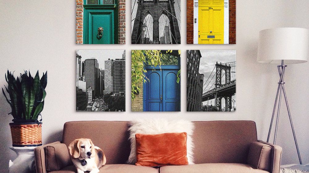 Black and white photography mixed with brightly colored prints in a living area