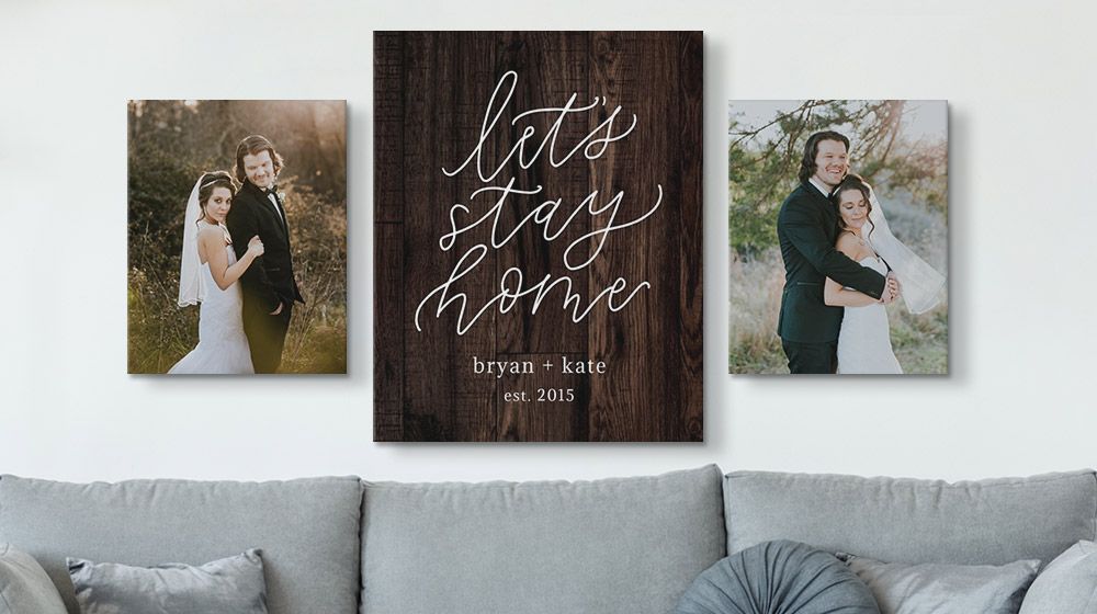 personalized word art canvas between two wedding photos on a wall