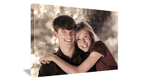 image of woman in red shirt hugging man in brown shirt