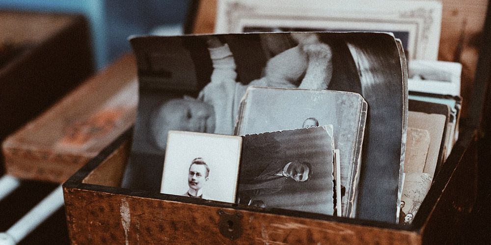 wooden box of old black and white photos
