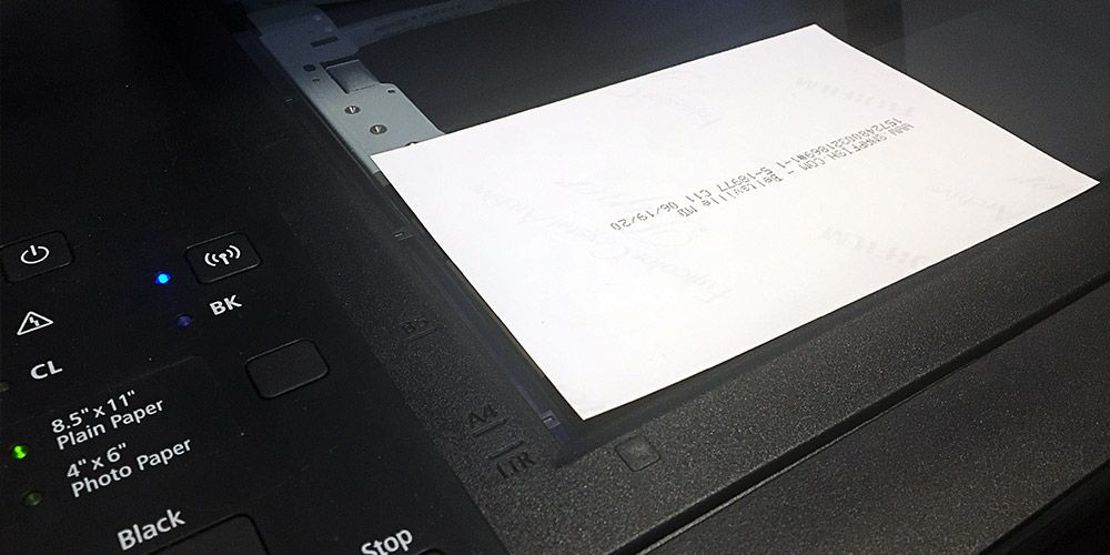 black computer scanner with photo on top