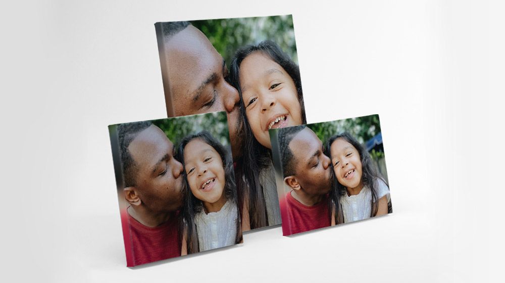 a variety of canvas sizes featuring a black dad and mixed daughter