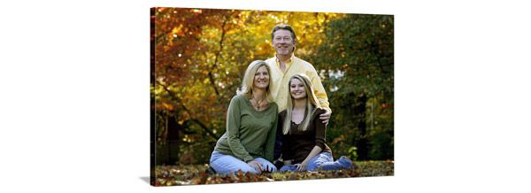 canvas of father, mother, and teenage daughter in fall foliage setting