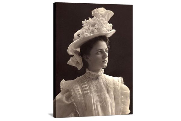 black and white image of woman in victorian dress and hat