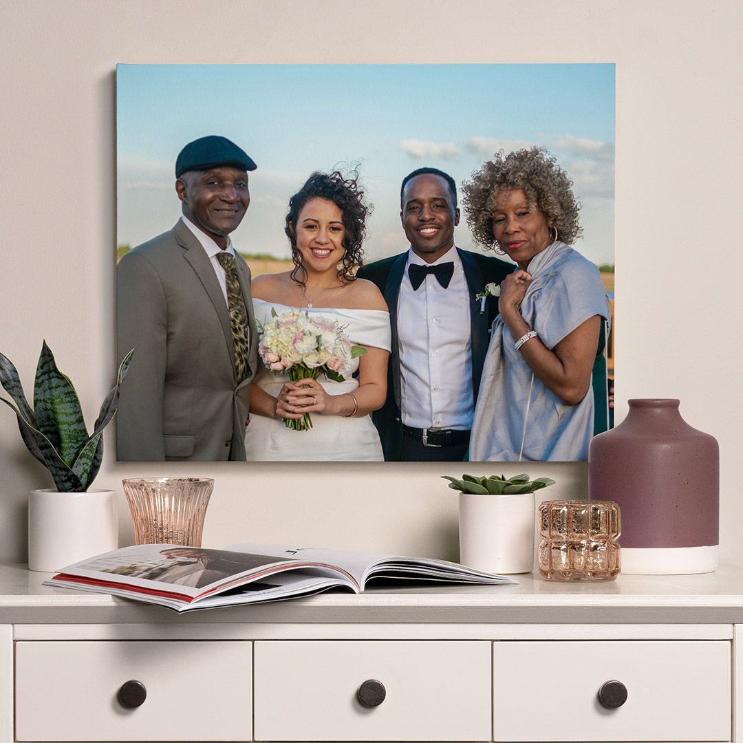 a sentimental wedding photo printed on canvas just above a small table with decor