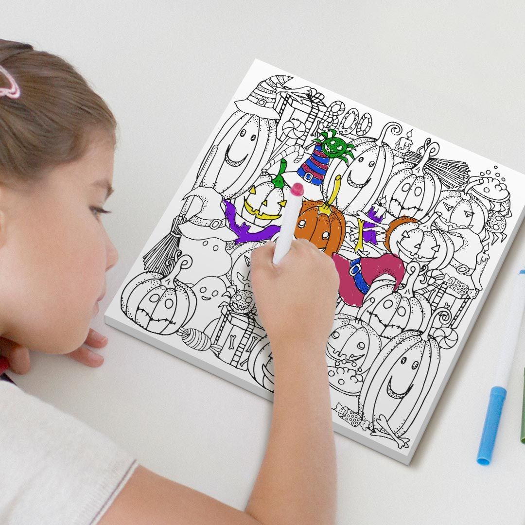 Kid coloring with markers on canvas
