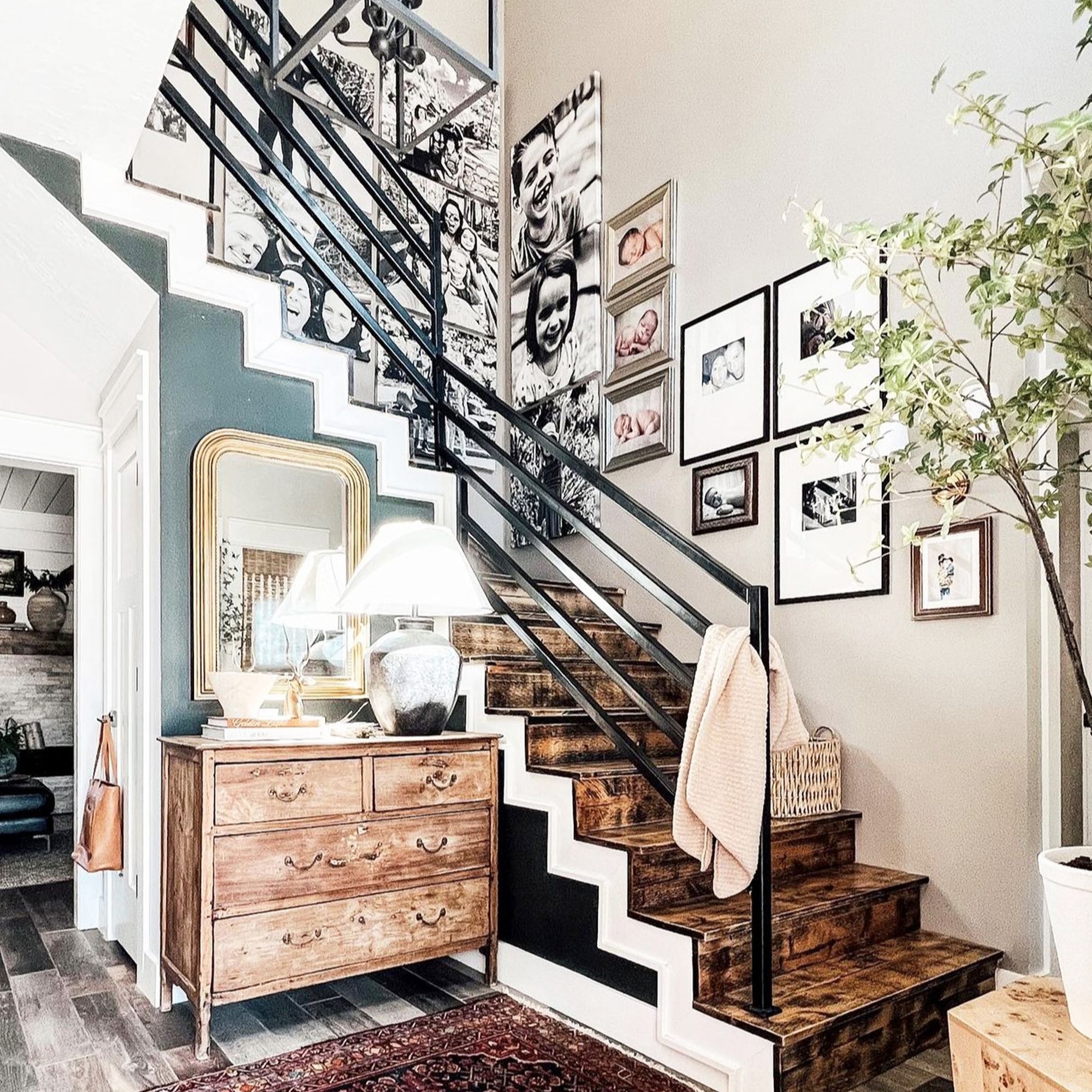 photo gallery wall hanging hanging above a staircase using canvas and framed prints